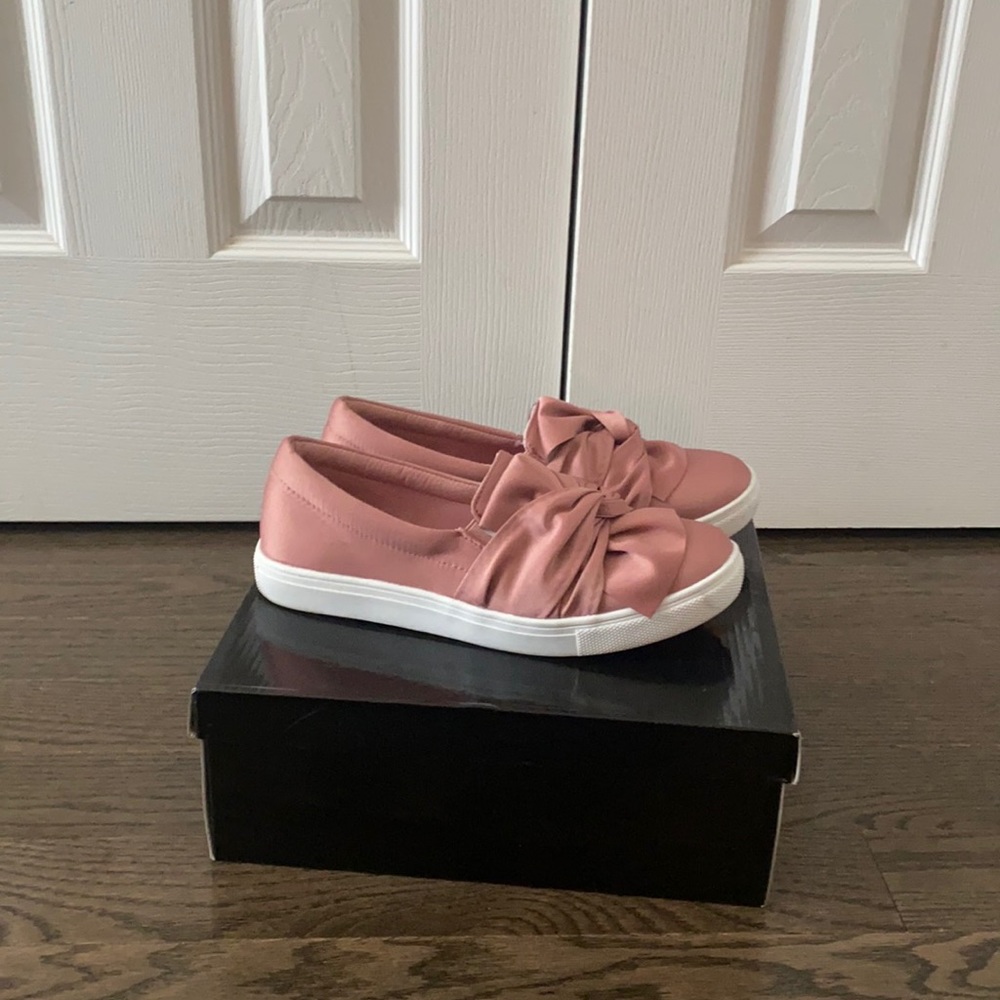 Pink slip on sneakers